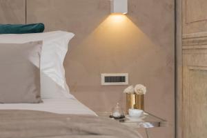 A bed or beds in a room at Navona Style