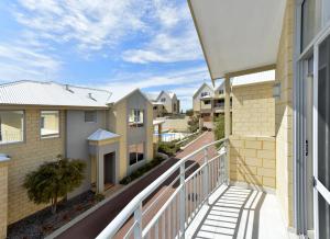a house with a balcony overlooking a city at Serenity on the Terrace in Mandurah