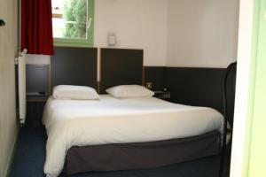 Letto o letti in una camera di Hôtel La Chartreuse
