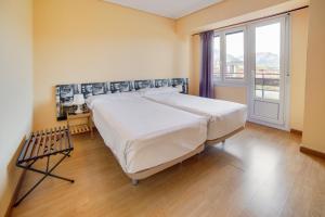 Postel nebo postele na pokoji v ubytování Hotel San Blas