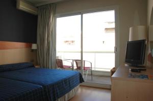 Posteľ alebo postele v izbe v ubytovaní Hotel President