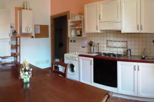 Kuchyň nebo kuchyňský kout v ubytování Il Glicine Apartment Rimini