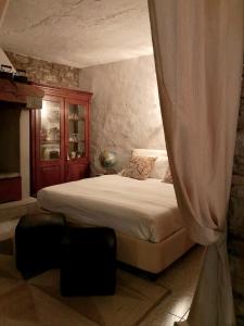 Un pat sau paturi într-o cameră la Casa al Riccio