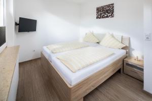 Ein Bett oder Betten in einem Zimmer der Unterkunft Ferienhaus an der Karlstraße
