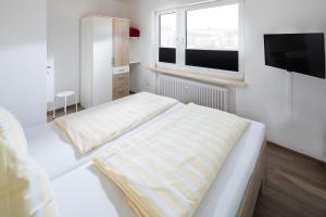 Ein Bett oder Betten in einem Zimmer der Unterkunft Ferienhaus an der Karlstraße