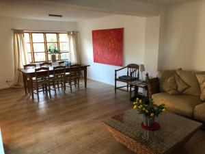 a living room with a couch and a table at Landhaus Hohenfelde in Hohenfelde