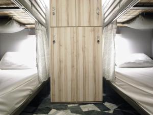 Poschodová posteľ alebo postele v izbe v ubytovaní Tainan Gu Hostel