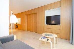 En TV eller et underholdningssystem på Hoom Apartments Juan Bravo