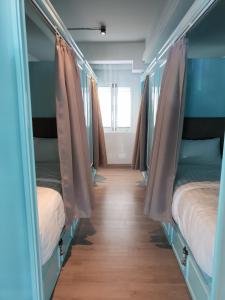 Postel nebo postele na pokoji v ubytování Latima Boutique Hostel