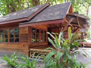 a small wooden cabin with a pitched roof at Lipe Beach Resort in Ko Lipe