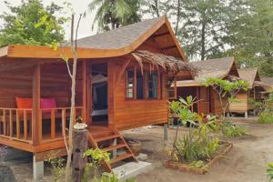 a small wooden house with a roof at Lipe Beach Resort in Ko Lipe