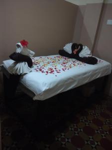 Säng eller sängar i ett rum på Raj Palace Sundar