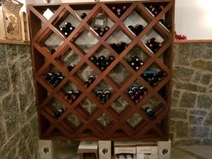 a wall of wine bottles in a wine cellar at Estancia Turística La Estiria in Trinidad