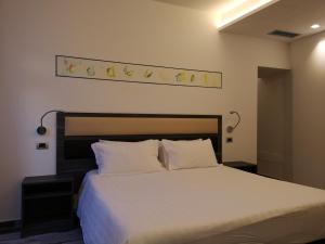 Postel nebo postele na pokoji v ubytování Palazzo IrMa - Hotel - B&B Luxury