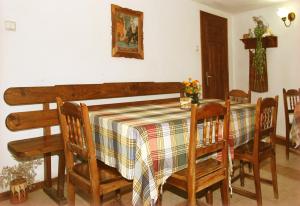 a dining room with a table and chairs at Nenchova Guest House in Koprivshtitsa