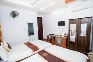 Voodi või voodid majutusasutuse Phuong Dong hotel toas