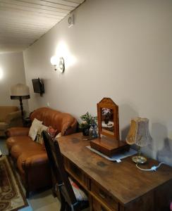 a living room with a table and a couch at Homestay Roja in Vilnius