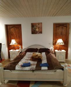 a bedroom with a bed with two night stands at Homestay Roja in Vilnius