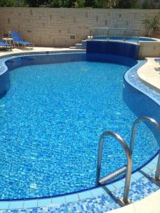 The swimming pool at or close to Angelica Studios and Apartments