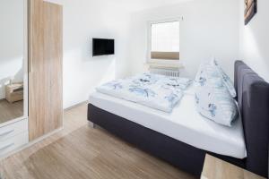 Ein Bett oder Betten in einem Zimmer der Unterkunft Ferienhaus an der Karlstraße