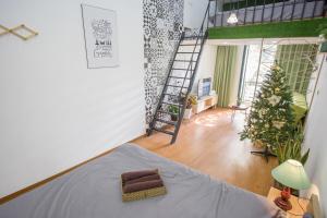 a room with a bed and a christmas tree in it at KemKay Homestay in Hanoi