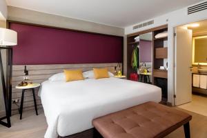 Postel nebo postele na pokoji v ubytování Mercure Ariosto Lima