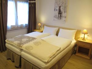 Ліжко або ліжка в номері Appartamenti Col Rodella