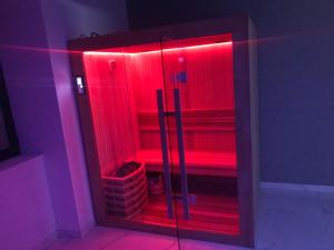 a bathroom with red lights in a room at Dreamspa in Audincourt