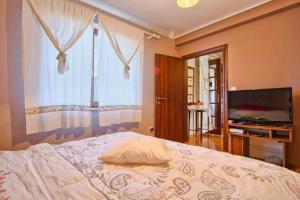 Postel nebo postele na pokoji v ubytování Apartman Turk