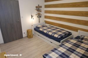 Posteľ alebo postele v izbe v ubytovaní Apartmány BD Boží Dar