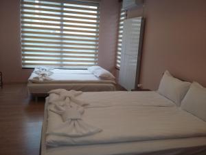 Postel nebo postele na pokoji v ubytování Guest House Ideal