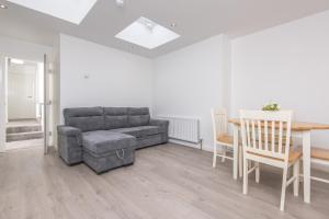 a living room with a couch and a table at The Gem in Armagh +3 photos