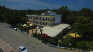 an aerial view of a building with a parking lot at Hotel Achillion in Makrýgialos