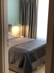 Posteľ alebo postele v izbe v ubytovaní Apartament Turkus