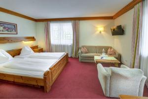 Katil atau katil-katil dalam bilik di Hotel Wechselberger by Alpeffect Hotels