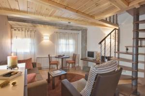 a living room with a couch and a table at Posada de Uncastillo in Uncastillo