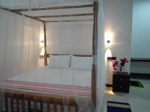 Postel nebo postele na pokoji v ubytování Calm Garden Cabanas