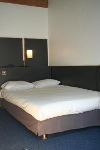 Letto o letti in una camera di Hôtel La Chartreuse