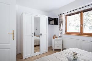 Posteľ alebo postele v izbe v ubytovaní ZAKOHOME- Apartament Skocznia
