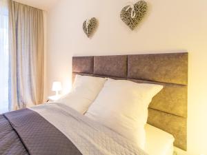 Posteľ alebo postele v izbe v ubytovaní Solmare Apartments