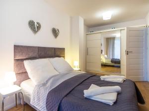 Posteľ alebo postele v izbe v ubytovaní Solmare Apartments