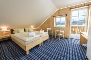 Postel nebo postele na pokoji v ubytování hotel Chalupa + 55 fotografií
