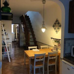 a dining room with a wooden table and chairs at Flat with Terrace in Adamastor in Lisbon