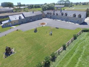 an aerial view of a large house with a large yard at Vent des Grèves in Pontorson