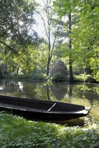 two boats sitting on the water in a park at KASTANIENHOF I in Burg