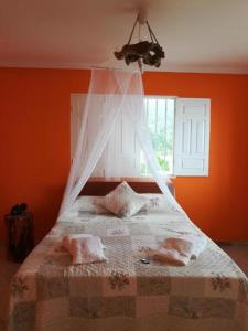En eller flere senge i et værelse på Gira Lua