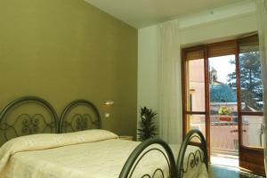Postel nebo postele na pokoji v ubytování B&B Vittoria