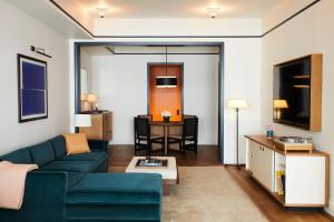 a living room with a couch and a table at Shinola Hotel in Detroit