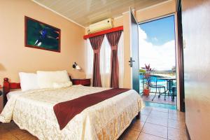 Postel nebo postele na pokoji v ubytování Hotel Las Colinas