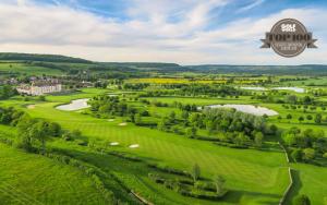 an aerial view of the golf course at the hôtel imperial with a view at Hôtel Golf Château de Chailly in Chailly-sur-Armançon